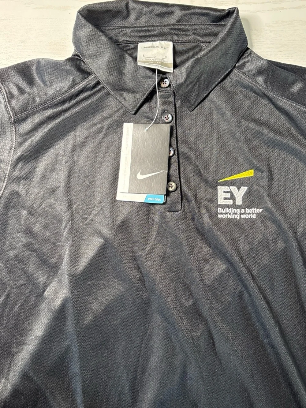 Nike women's Black Polo with Embroidered Logo and Yellow Accent